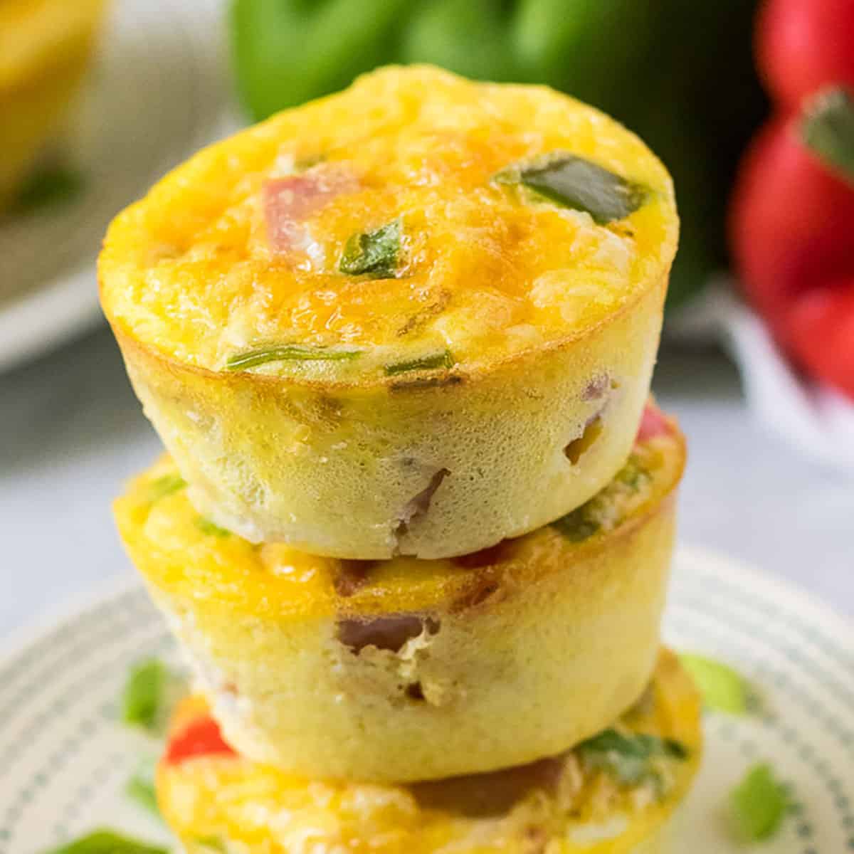Stack of omelette egg muffins on a blue and white plate.