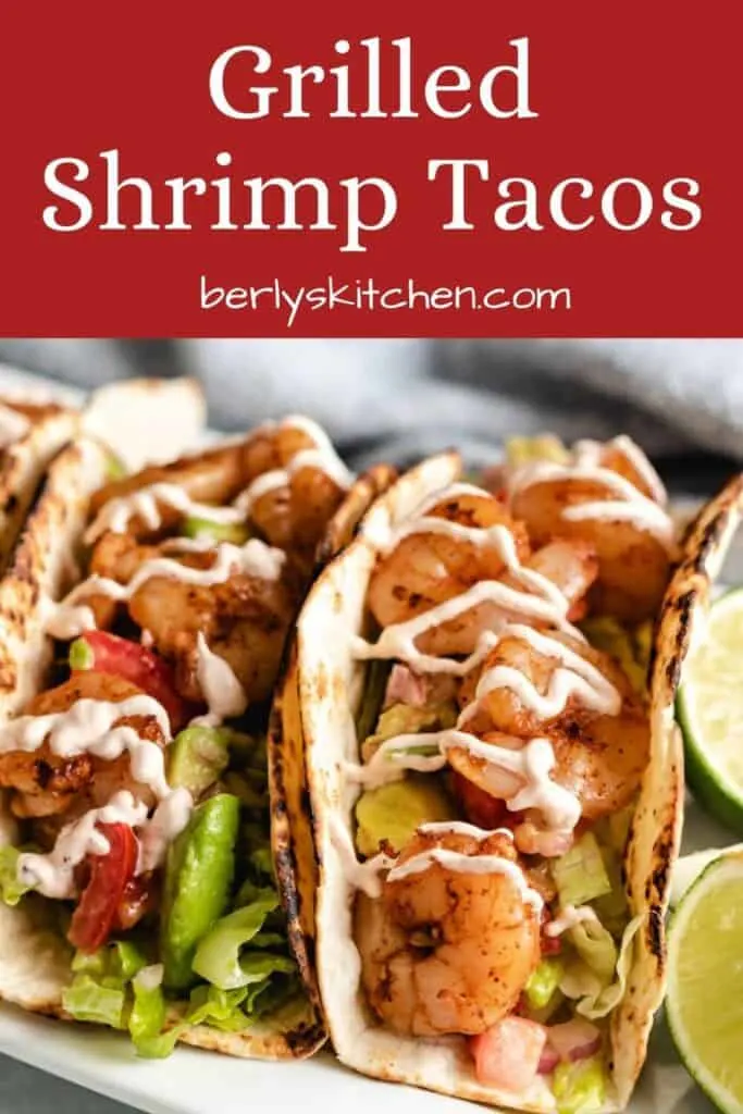 A close-up of the grilled shrimp tacos topped with chipotle cream sauce.