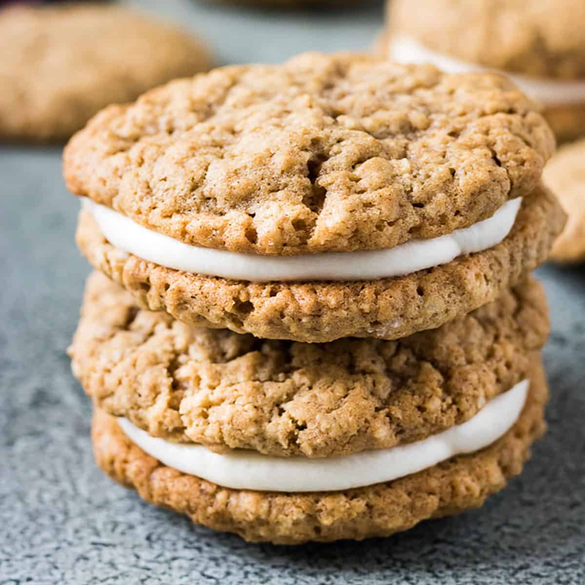 Two oatmeal cream pies stacked on a gray table.
