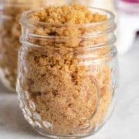 Homemade dark brown sugar in a small mason jar.