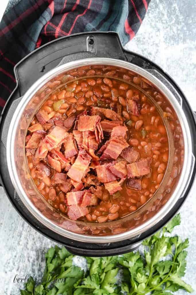 Everything has cooked and bacon has been added to the beans.