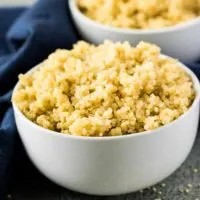 White bowl filled with Instant Pot Quinoa.