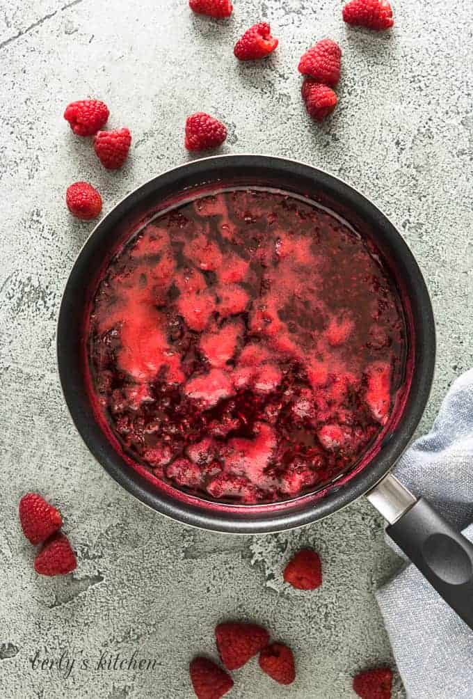 The berry syrup has cooked down in the pan.