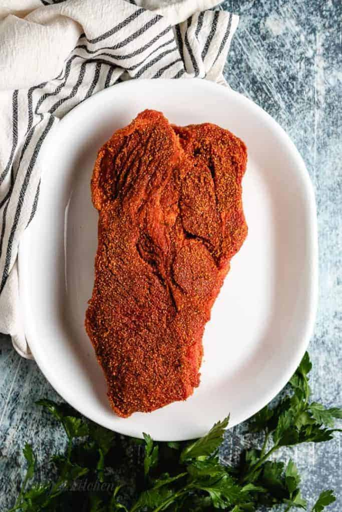 The roast has been even coated in dry rub.