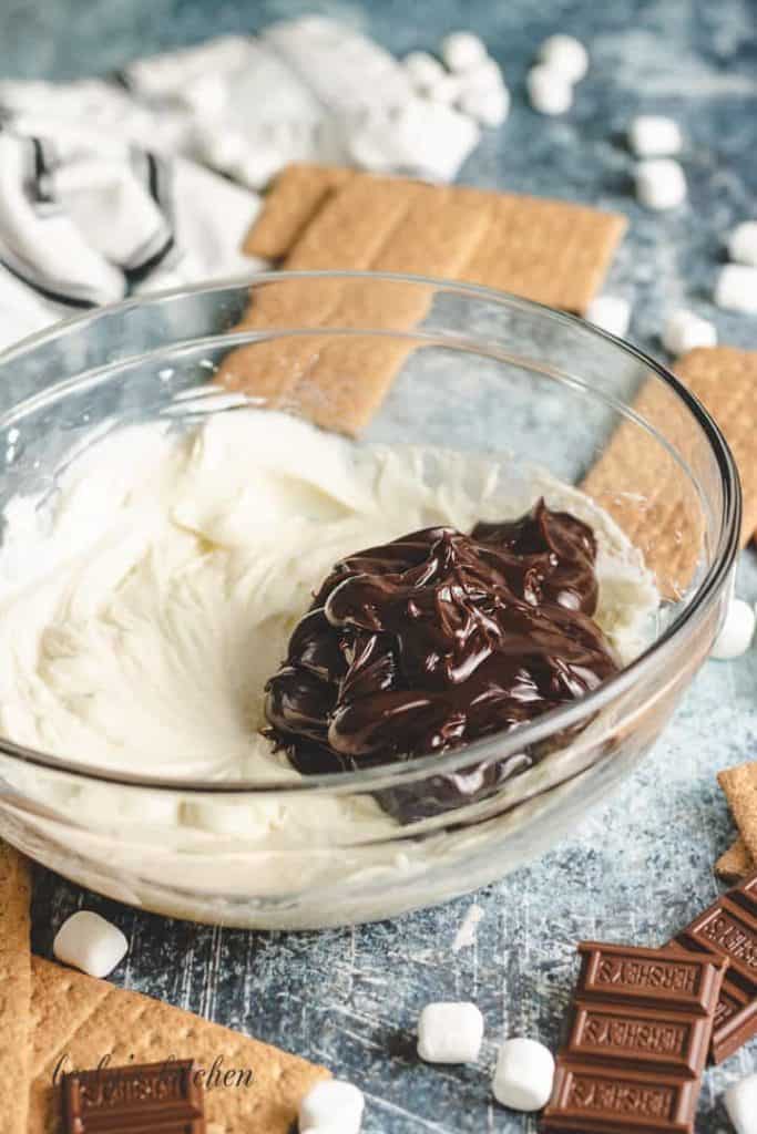 Hot fudge has been added to the cream cheese mixture.