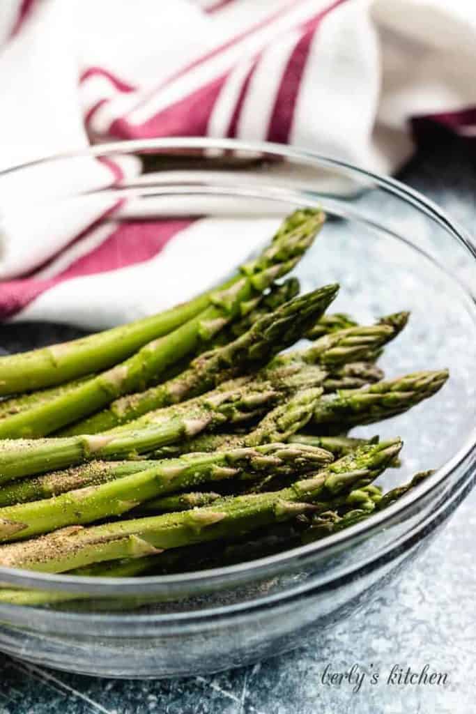 The trimmed asparagus in a mixing bowl.