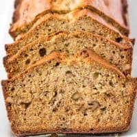 Several slices of banana bread on a platter.