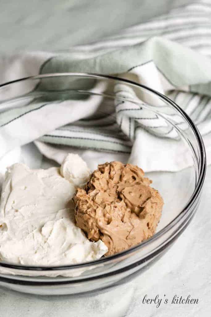 Softened cream cheese added to the mixing bowl.