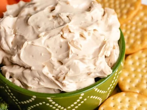 The finished French onion dip in a decorative bowl.