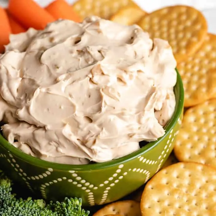 The finished French onion dip in a decorative bowl.
