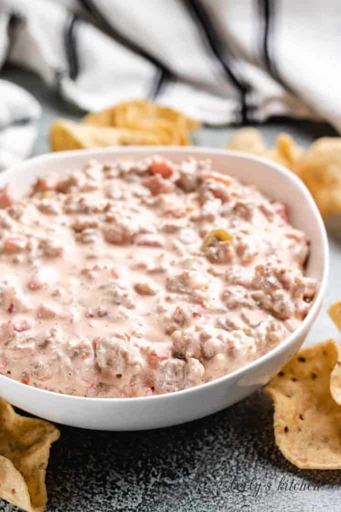 The dip is done and served in a white bowl.