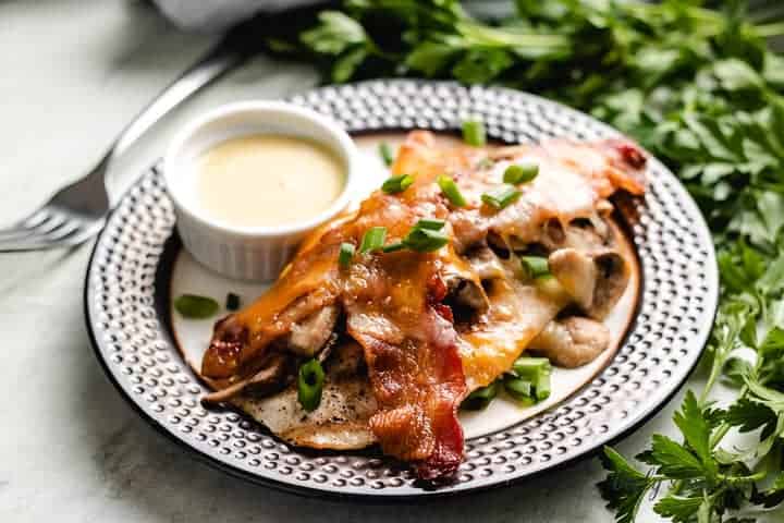 The loaded chicken breast topped with cheese and bacon.