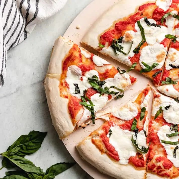 A slice of the Margherita pizza cut from the pie.