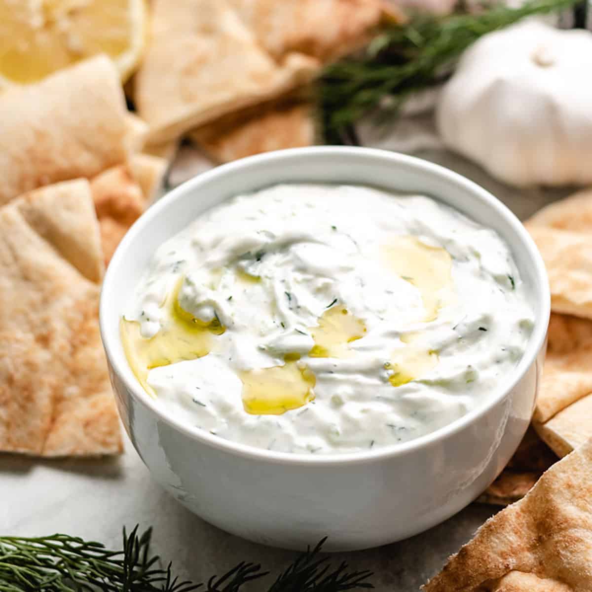 The finished tzatziki sauce served with pita chips.