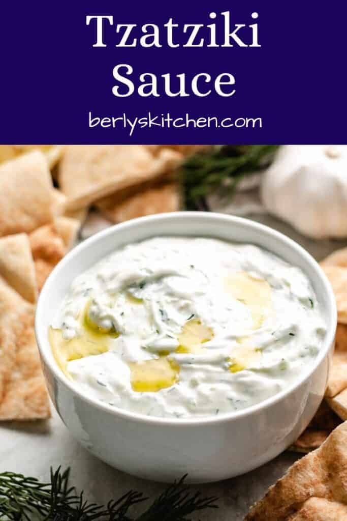The tzatziki sauce with pita chips and fresh dill.