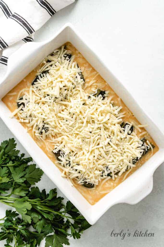 The peppers covered with batter and shredded cheese.