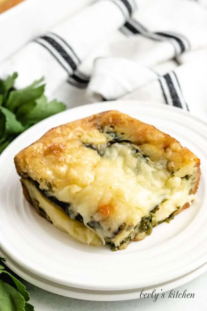 A small square of the finished casserole on a plate.