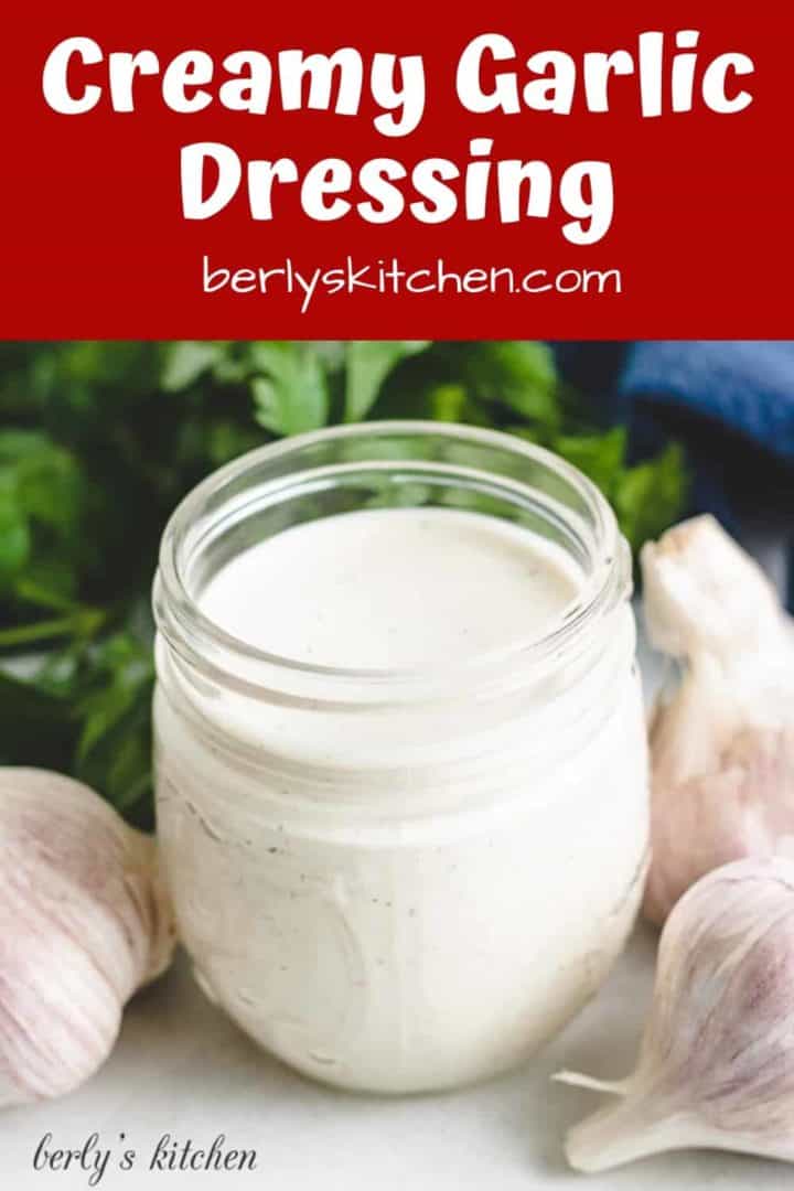 The finished creamy garlic dressing in a small jar.
