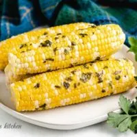 The grilled corn on the cob on a plated.