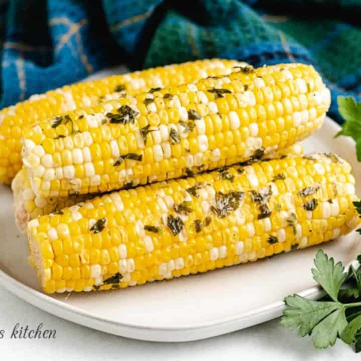 The grilled corn on the cob on a plated.