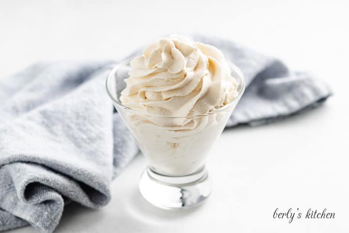 A serving of maple whipped cream in a glass.