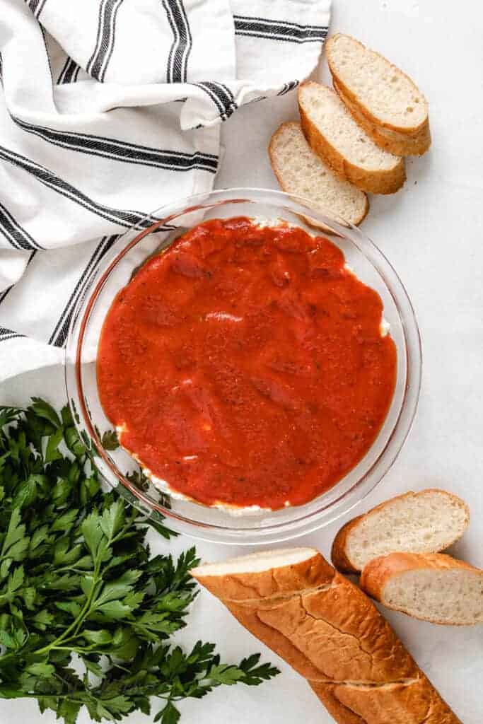 Pizza sauce spread over the dip mixture.