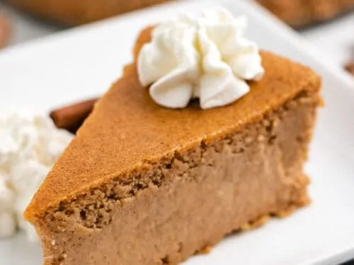 A slice of cheesecake removed from the pan.