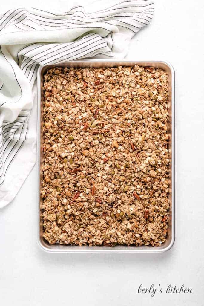 Pumpkin Spice Granola The mixture has been transferred to a sheet pan.