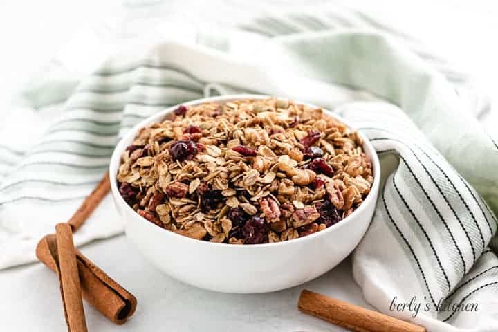 A small bowl filled with pumpkin spice granola.