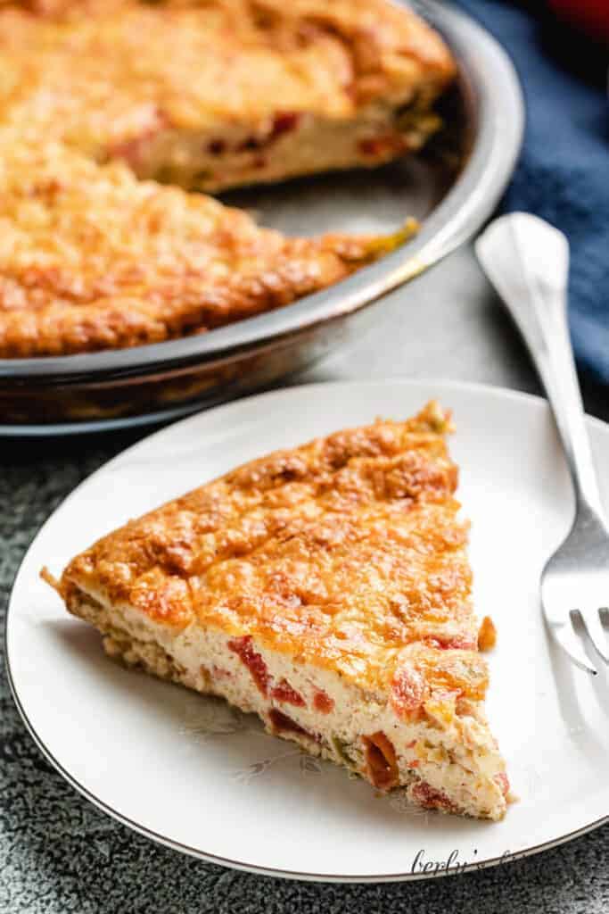 An aerial view of a slice of the finished crustless quiche.