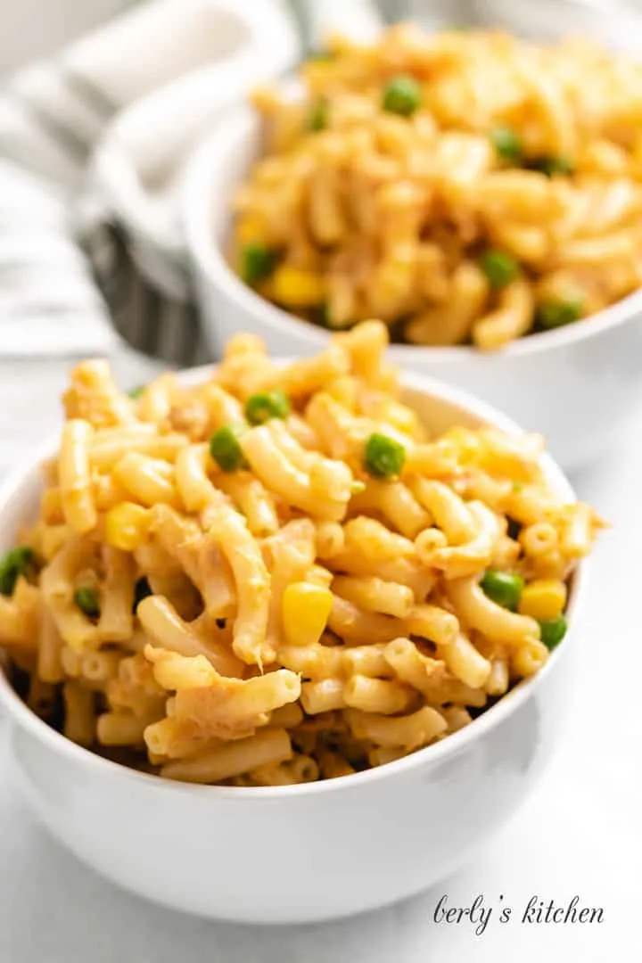 A close-up of creamy tuna mac and cheese in white bowls.