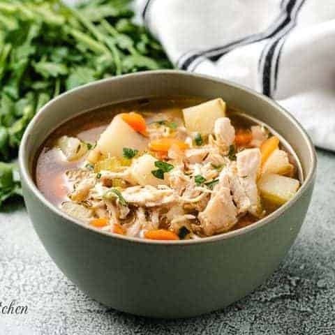 A serving of the chicken potato soup in a bowl.