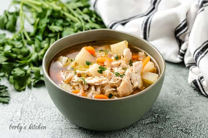 A serving of the chicken potato soup in a bowl.