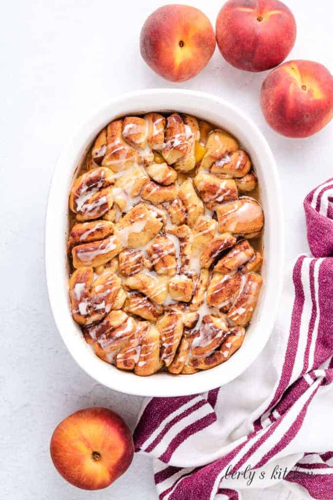 The cobbler in the baking dish topped with icing.