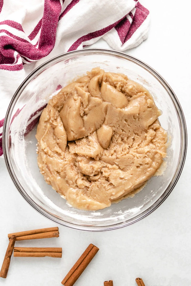 Flour and other dry ingredients added to the bowl.