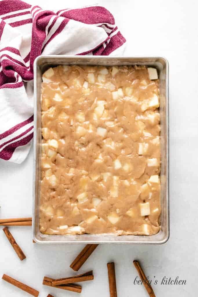 The cake batter transferred to a cake pan.
