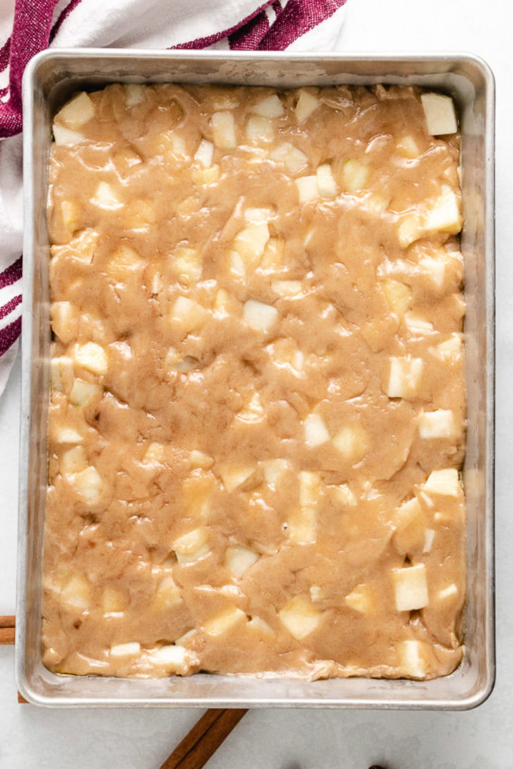 The cake batter transferred to a cake pan.