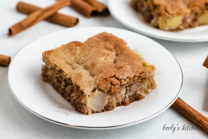 A serving of fresh apple cake on a plate.