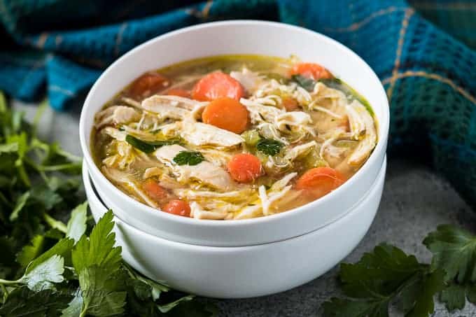 A bowl of the homemade chicken soup showing the ingredients.
