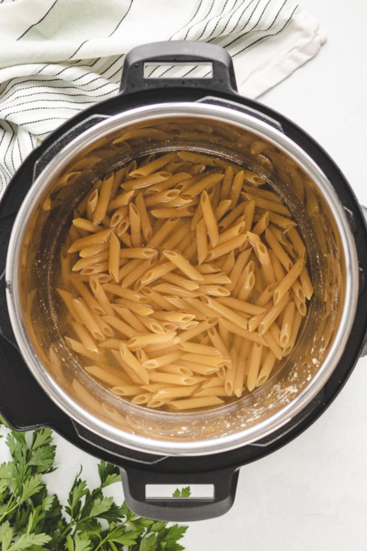 Noodles and broth in an Instant Pot.
