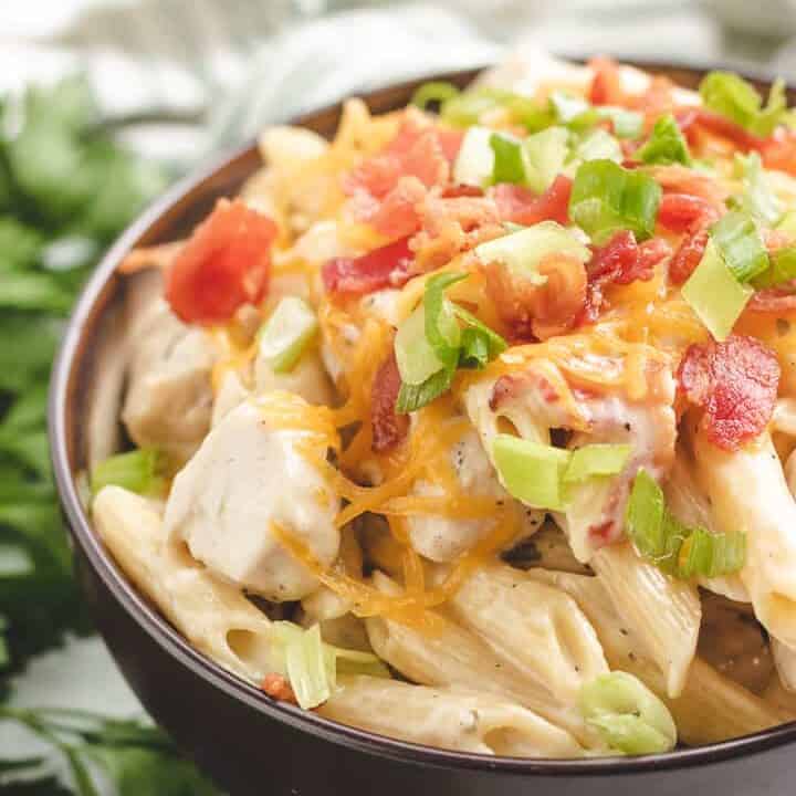 Brown bowl with chicken pasta.