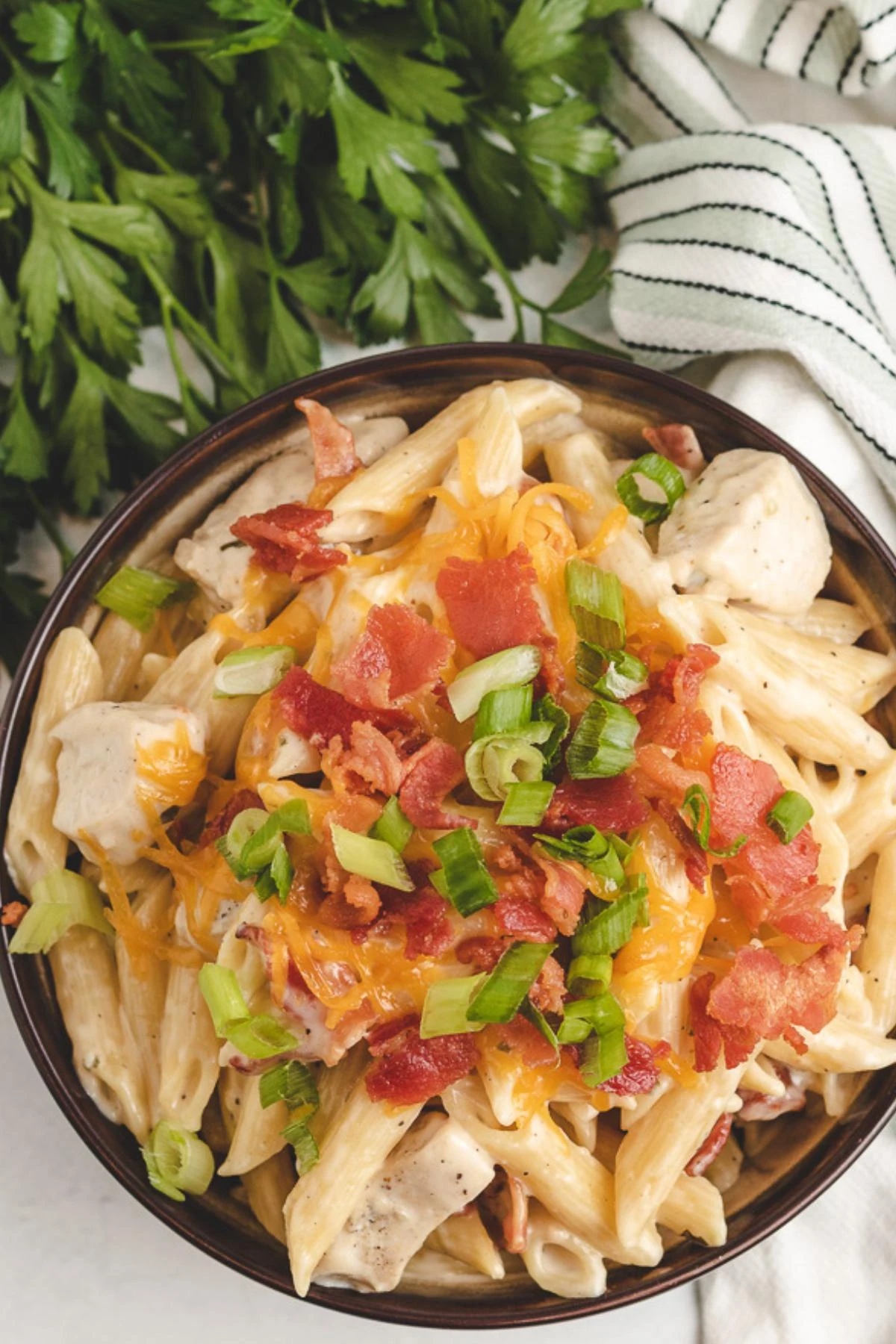 Top down photo of chicken bacon ranch pasta in a bowl.