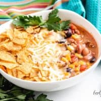 Stove top taco soup served with fresh cilantro and cheese.