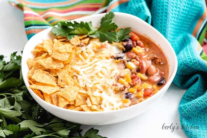 Stove top taco soup served with fresh cilantro and cheese.