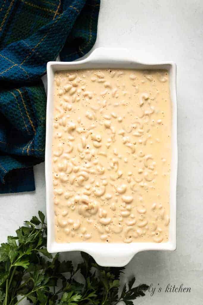 The macaroni and cheese transferred to a baking dish.