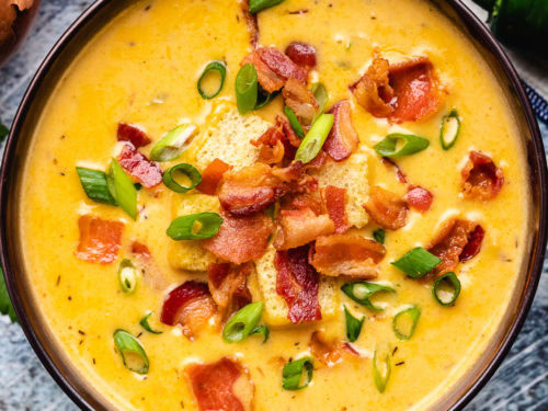 An aerial view of the beer cheese soup in a bowl.
