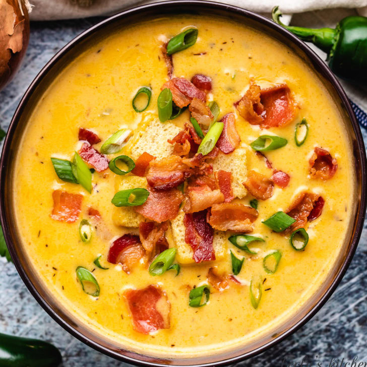 An aerial view of the beer cheese soup in a bowl.