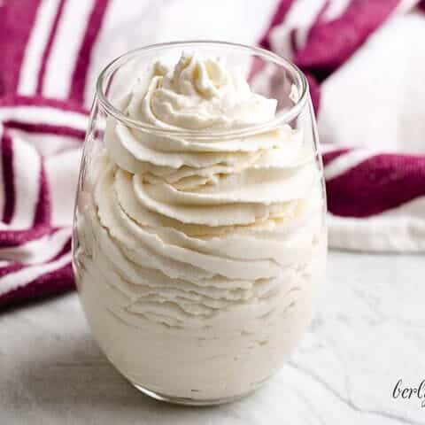 The finished bourbon whipped cream in a glass.