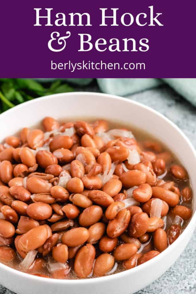 An up-close view of pinto beans and ham hocks.