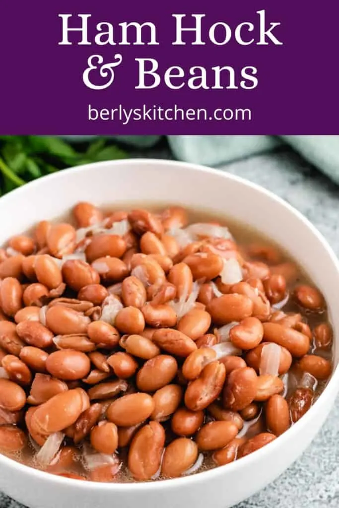An up-close view of pinto beans and ham hocks.